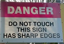 funny sign Danger do not touch this sign has sharp edges